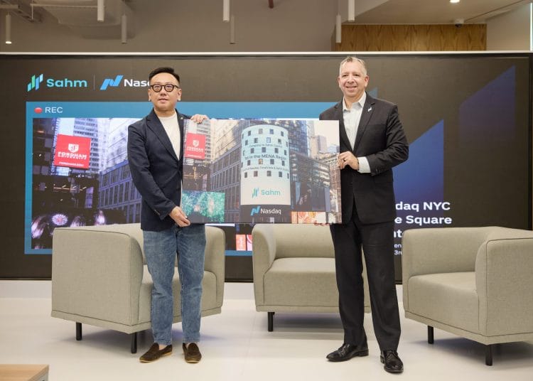 Photo Caption: Brandon Tepper, Senior Vice President and Global Head of Data at Nasdaq, presents a commemorative photo gift to Steven Chou, Chairman of Sahm Capital, during the launch ceremony of the Sahm - Nasdaq Investor Education Program. The photo captures the collaboration announcement featured on the Nasdaq Times Square billboard in New York City.